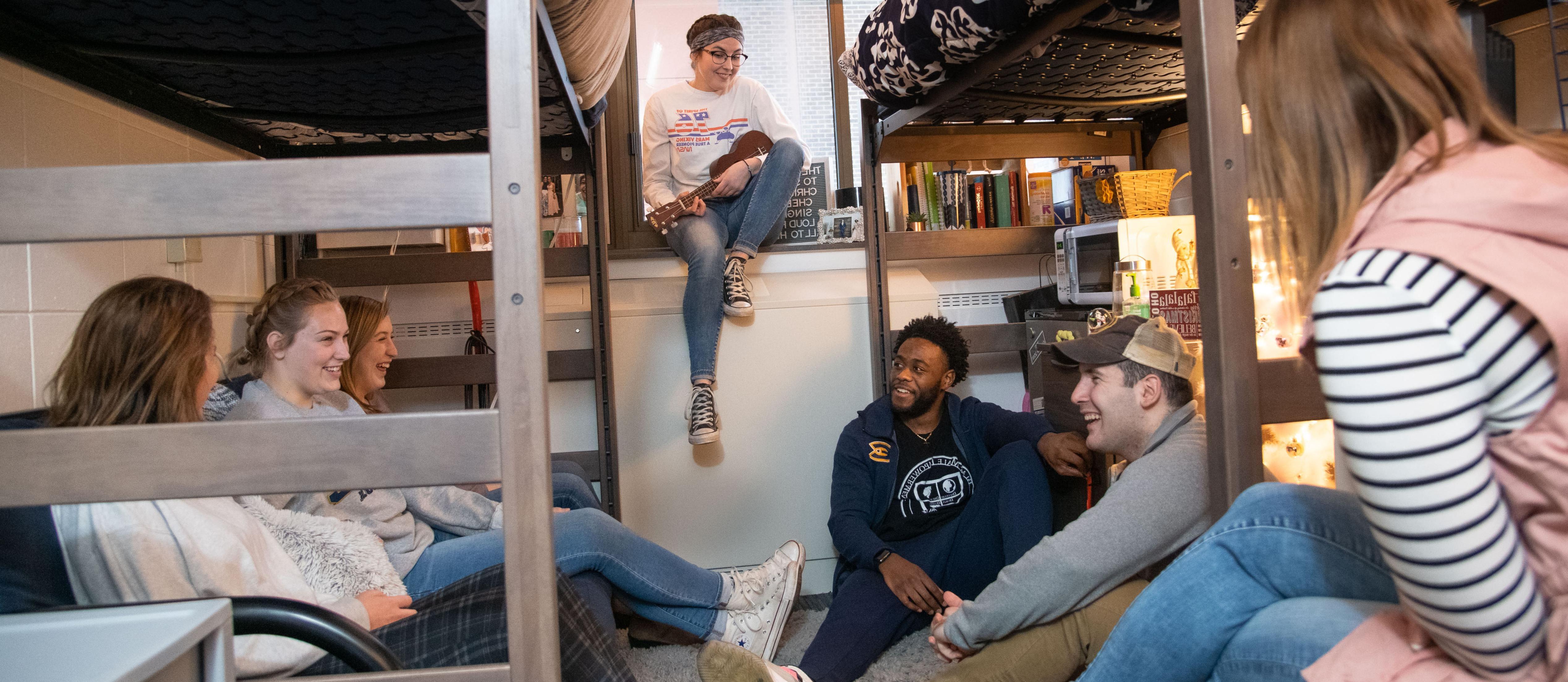 Students hanging out in residence hall room