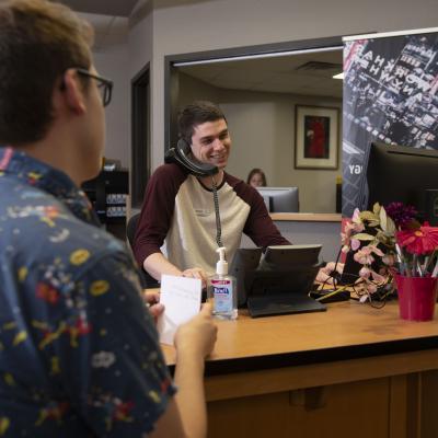 Help Desk student assisting client 