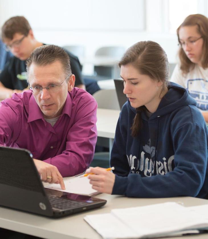 Math instructor working with a student 